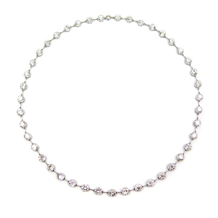 Diamond set chain necklace, millegrain collet set
